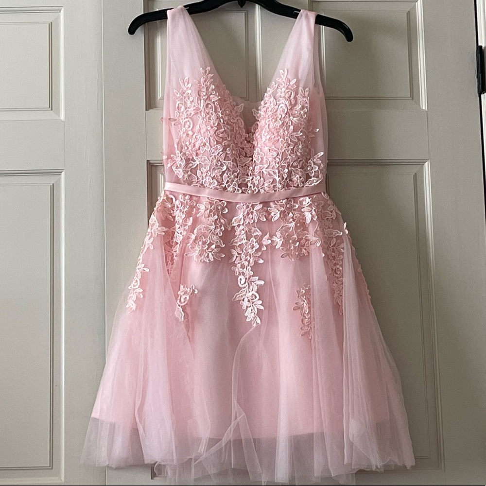 Formal light pink, with flower designs, has pearls, never been worn, size XS